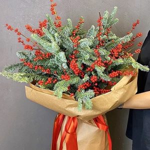 Orang and green Christmas flower arrangement