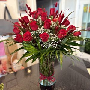 Red roses flower arrangement in a vase